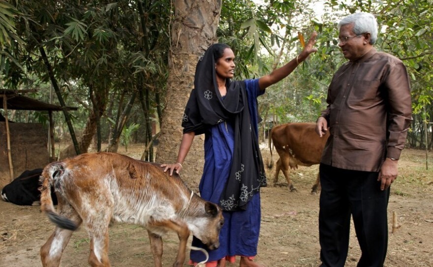 Abed meets with a Bangladeshi villager who was given a cow as part of BRAC's "graduation program."