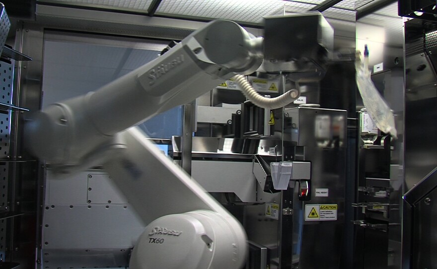 Palomar Medical Center's robot RIVA helps mix and prepare IV medications.