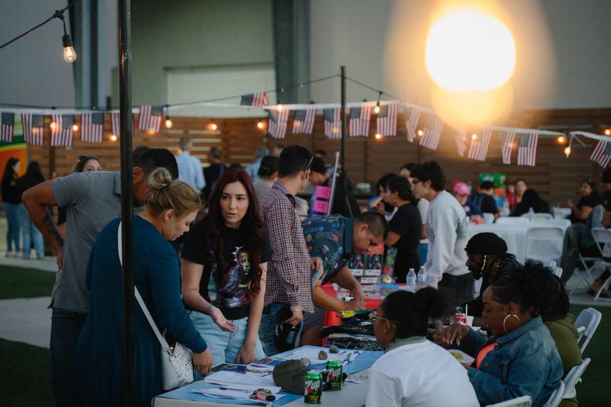 Attendees talk during an information event organized by the ACLU’s Imperial Valley team, along with five other local advocacy organizations, on Oct. 18, 2024. The coalition is hoping to register hundreds of new voters and get people energized about casting their ballots ahead of the November election.