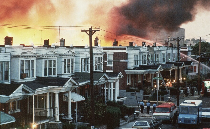Flames shoot skyward at the MOVE compound in West Philadelphia on May 13, 1985.