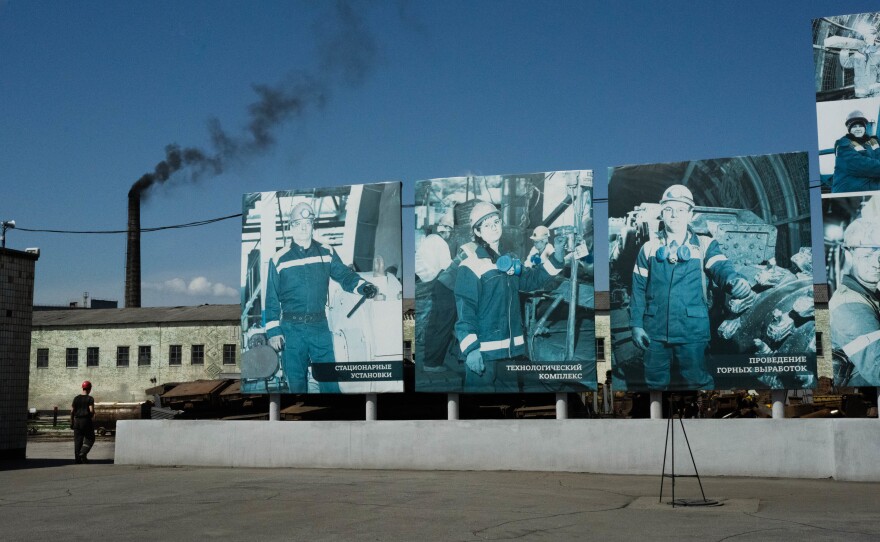 Signs of workers rise above the grounds of a coal mine in eastern Ukraine.