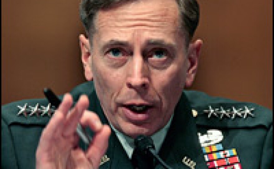 U.S. Army Gen. David Petraeus talks to members of the Senate Armed Services Committee on May 22.