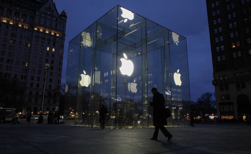 A man walks outside the Apple store on the Fifth Avenue in New York on Wednesday.