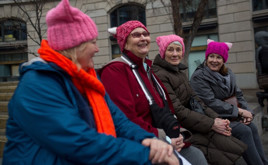 (Left to right) Melissa Breen, Laura Jamison, Sandy Cuza and Kathryn Wehrmann chat while sporting matching pink hats in support of the march.