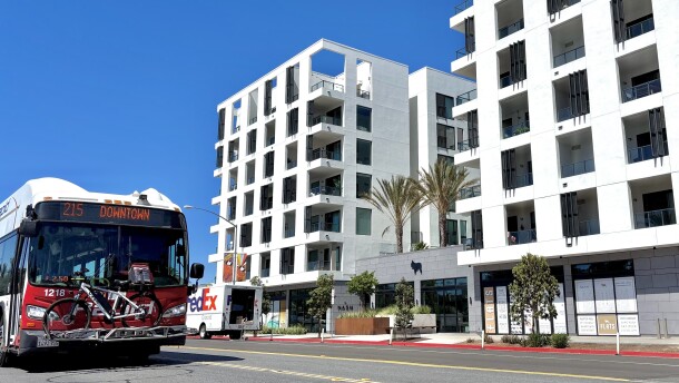 An MTS bus headed for downtown passes the Nash apartment building in North Park, July 25, 2025.
