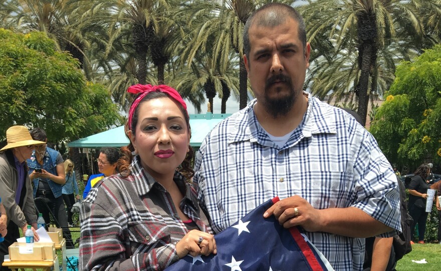 At a recent anti-Donald Trump protest in Anaheim, California, this couple said they saved the U.S. flag from a Trump supporter who was trying to get Latinos to trample it. Nervous about giving their full names, he said his was Anthony, and she said she was going by "America."