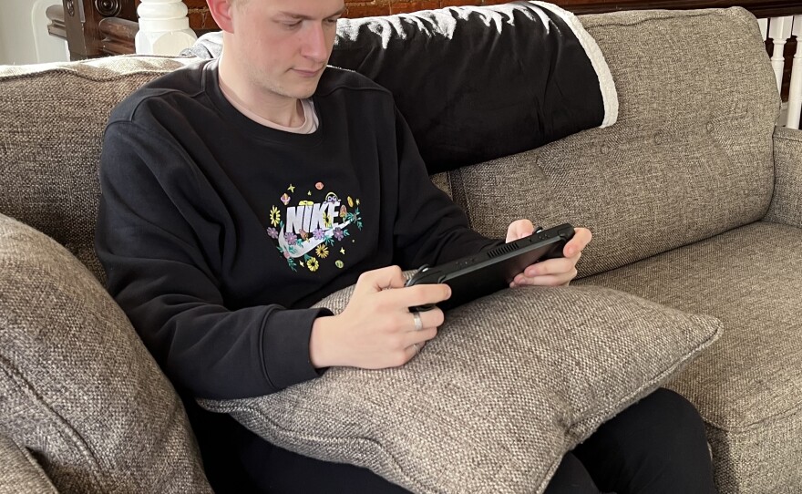 My preferred method for handling the Steam Deck, with a pillow helping to cushion the weight.