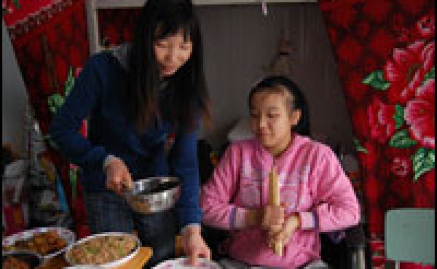 Because of her disability, Meihua and her parents have a room to themselves at a temporary school in Mianyang county. Other children live eight or 10 to a room in rows of pre-fab barracks.