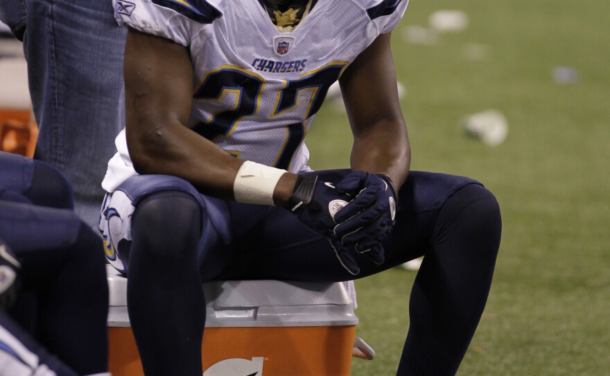 San Diego Chargers safety Paul Oliver sits on the bench in the fourth quarter of an NFL football game against the Indianapolis Colts in Indianapolis, Nov. 28, 2010. 