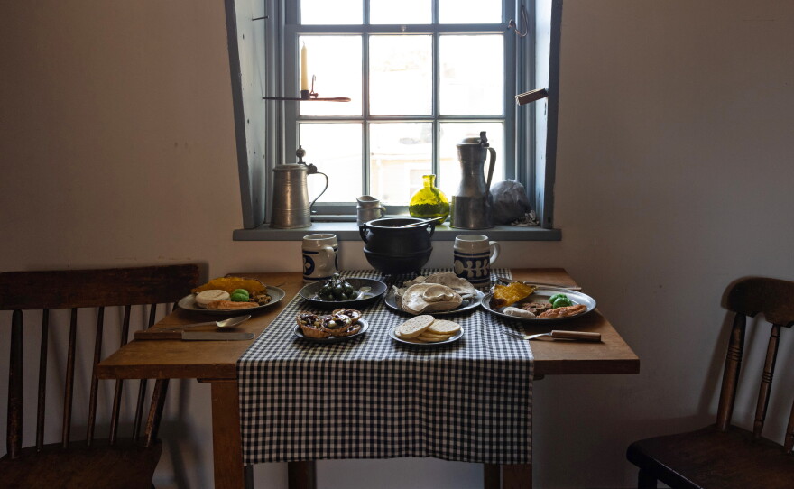 A table setting depicting a typical working-class meal in 18th century Annapolis is displayed at Hogshead Trades Museum in Annapolis.