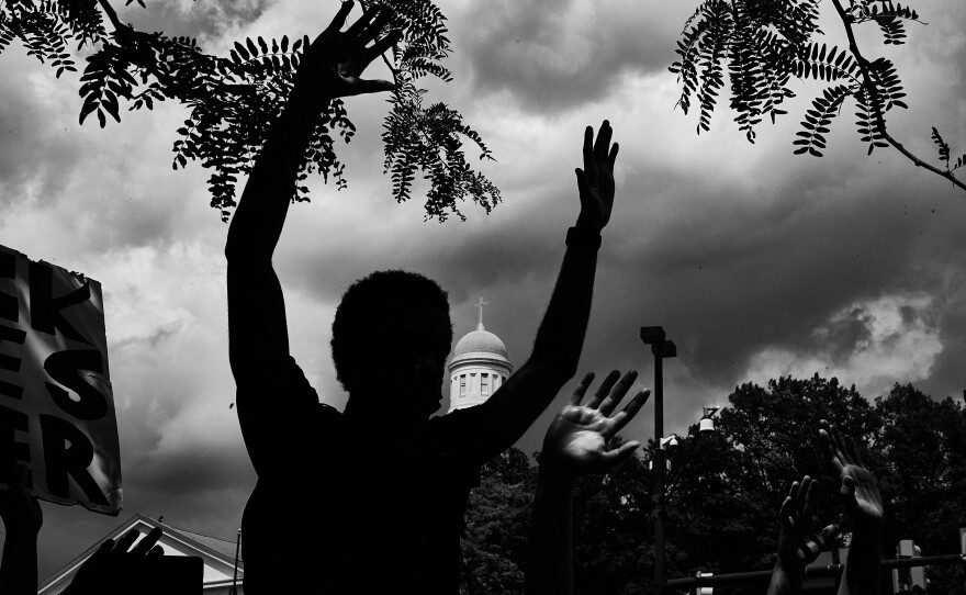 Protesters honor George Floyd, Breonna Taylor and Tony McDade in front of a police station in Baltimore, Md., in 2020.