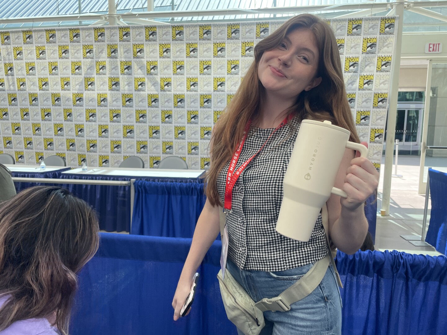 Nicole Carmody, event manager at Temecula's new romance bookstore, In Bloom Bookery, is shown on Thursday, July 24, 2025 with the lone item in her Comic-Con survival kit: water.
