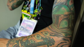 A Star Wars-themed tattoo sleeve featuring Boba Fett is flexed at Comic-Con, July 24, 2026.
