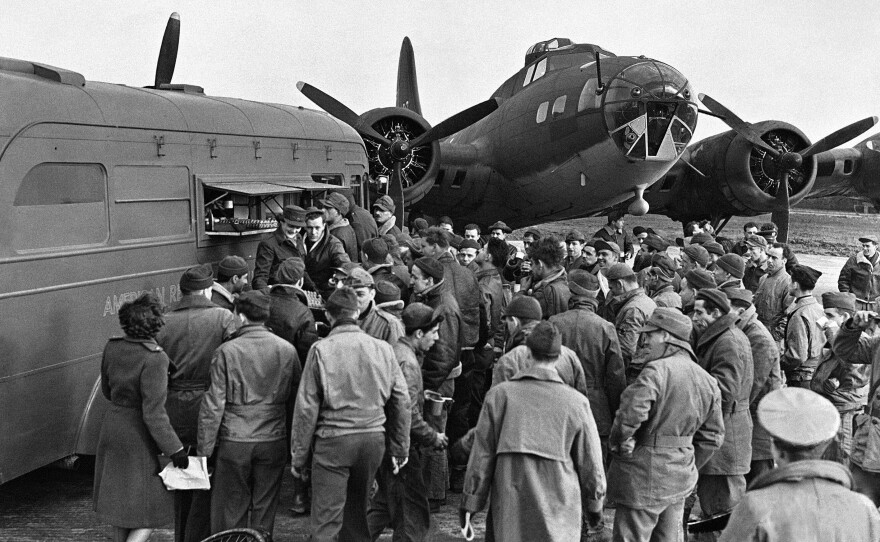 During World War II, the American Red Cross Clubmobile corps (shown here on an airfield in England in 1943) provided donuts, coffee and friendly conversation to the troops.