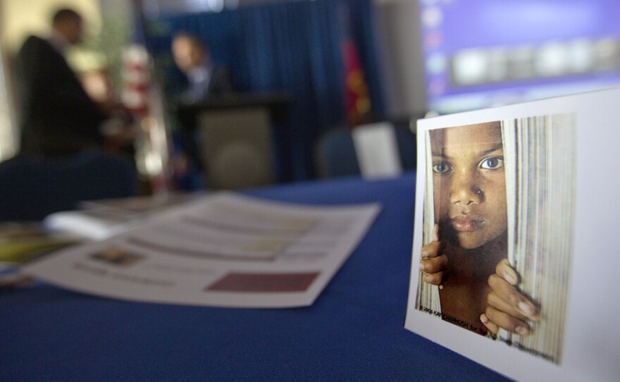 A placard of a child sits on a table during a conference Oct. 31 on human sex trafficking in Atlanta. The Georgia Department of Education estimates that about 5,000 girls in the state are at risk for trafficking each year.