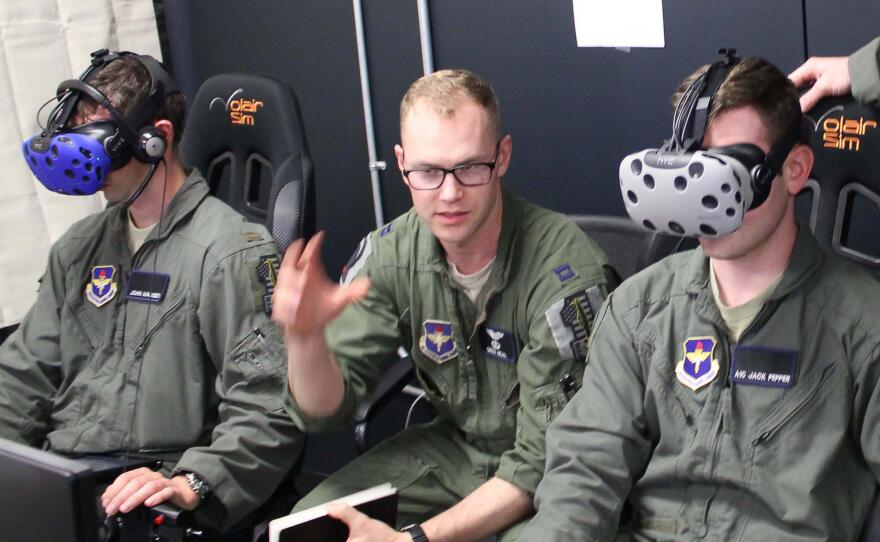 Instructor pilot Capt. Grizz Neal (right) oversees Lt. John Massey and Airman 1st Class Jack Pepper on the Pilot Training Next simulator in this undated photo.