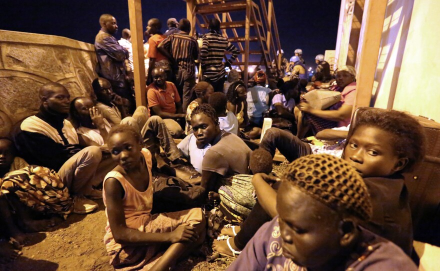 South Sudanese huddled for safety as fighting erupted in Juba on July 8.