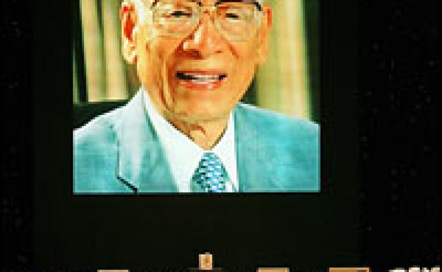 A large portrait of Momofuku Ando, inventor of instant noodles, is projected during his funeral at the Kyocera Dome stadium in Osaka, Japan, Feb. 27, 2007.