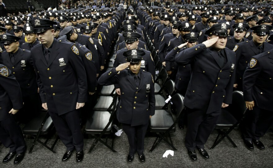 A New York City police academy graduation ceremony on Dec. 28, 2012, where Mayor Michael Bloomberg announced that the New York murder rate has hit an all-time low. While some point to the NYPD's policing tactics to explain the decline, others say economic and demographic shifts are also at work.