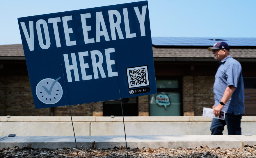 A voter walks to polling place in Milwaukee on Tuesday.