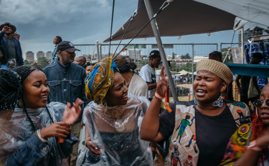 While the Afropunk Joburg festival was on pause because of the weather, crowds make their own music, singing freedom songs.