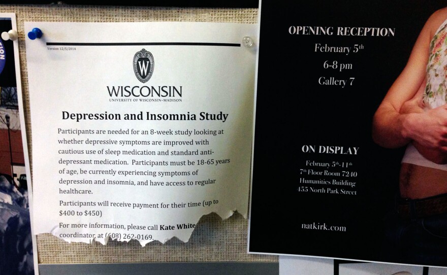 A posting on a bulletin board outside the counseling offices at the University of Wisconsin invites people to participate in a study on depression and insomnia.