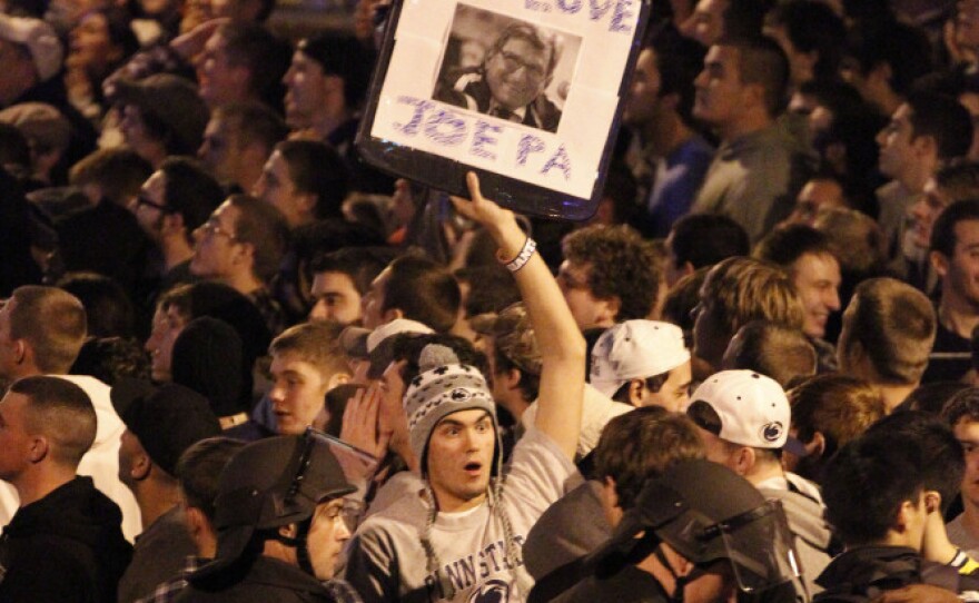 Scores of students gathered late Wednesday near the Penn State campus in State College, Pa., to protest the firing of football coach Joe Paterno. Dozens of police officers wearing helmets and carrying pepper spray were called in to control the crowd.