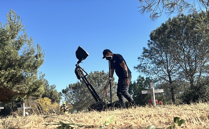 Jimmy Daniels operates a ground penetrating radar device as he searched for unmarked graves in a Del Mar cemetery. Dec 7, 2024