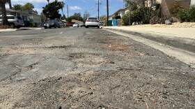 A close up view of a road in the College East neighborhood of San Diego that has been identified in the city's Pavement Management Plan as in need of repair.