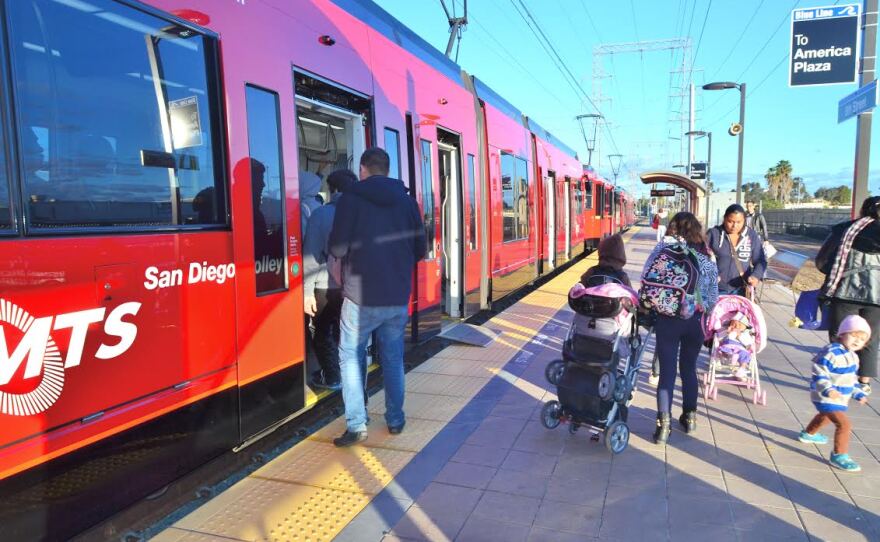 People are shown walking into a low-floor trolley on Jan. 27, 2015.