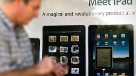Customers waited in line outside Apple stores across the country to purchase the new iPad. Apple is marketing it as a revolutionary device that lets you feel like you're "holding the Web right in the palm of your hand."