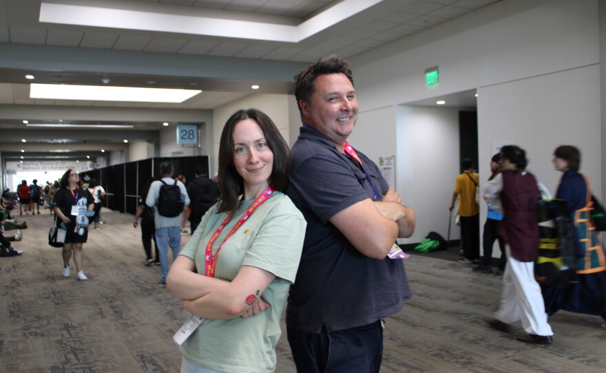 Mallory Rubin (left), the director of content at the Ringer and co-host of the podcast "House of R" poses with KPBS Roundtable host Andrew Bracken in the hallway of the San Diego Convention Center, Thursday, July 23, 2026.