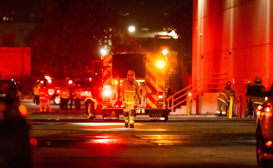 First responders work the scene after a helicopter crashed near a bus crash in Chatsworth, a neighborhood in Los Angeles, Tuesday, Sept. 15, 2026.