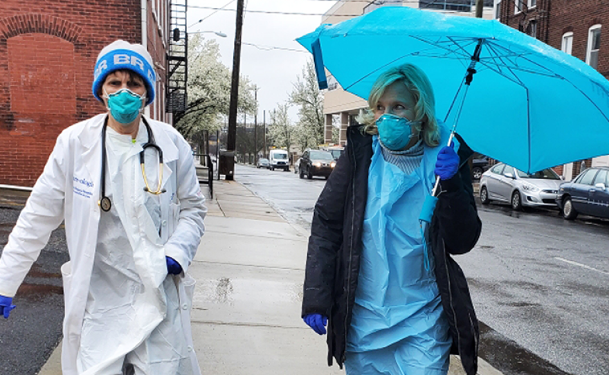 Medical professionals wear masks and protective gear to lower their risk while working on the front lines. (Undated photo)