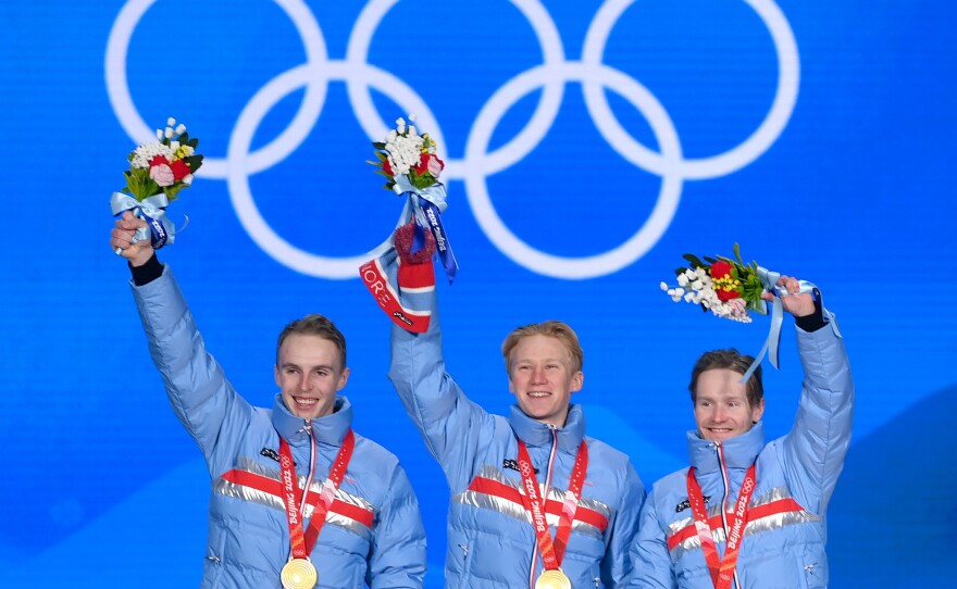 Gold medallists Hallgeir Engebraaten, Peder Kongshaug and Sverre Lunde Pedersen of Team Norway pose during the Men's Team Pursuit medal ceremony at the Beijing 2022 Winter Olympics on February 15, 2022.