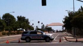 A police car near the entrance gate at Marine Corps Air Station Miramar where a man was detained for allegedly making threatening statements.