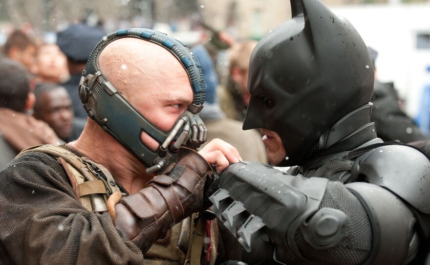 Face off: Tom Hardy's Bane takes on Christian Bale's Batman and we do wonder who will actually win.