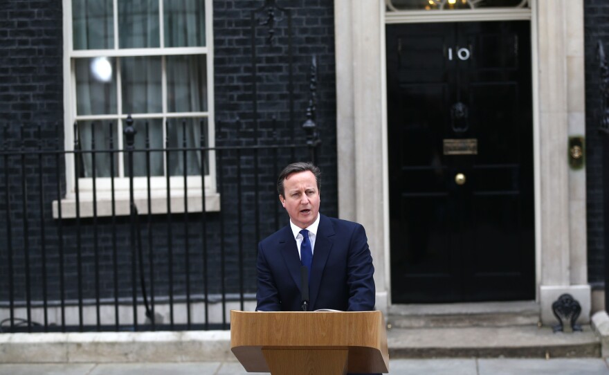 British Prime Minister David Cameron speaks in front of 10 Downing Street after meeting with Queen Elizabeth II on Monday.