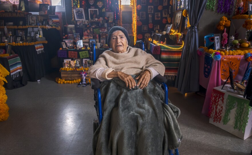 94-year-old Anita Lopez has lived in the Sherman Heights community since 1972. She has come to view the altars every year since the community first began creating them at the Sherman Heights Community Center 30 years ago, Oct. 15, 2024.