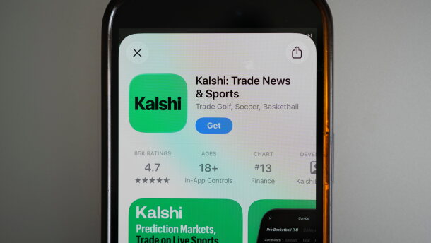 FILE - An ad for the prediction market app Kalshi is displayed on a mobile phone on April 16, 2026, in Chicago. (AP Photo/Erin Hooley, File)