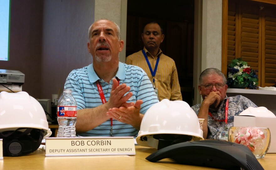 Robert Corbin (left), deputy assistant energy secretary for the Office of Petroleum Reserves, speaks at the Bryan Mound site near Freeport, Texas, on June 9. He says the Strategic Petroleum Reserve fills a vital economic role.