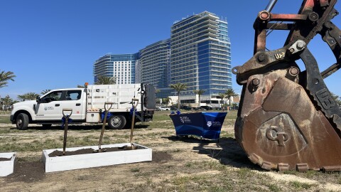 Construction vehicles and shovels sit on top of what will soon become Harbor Park, March 3, 2026.