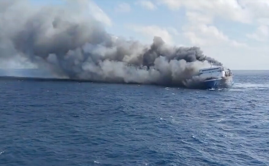 In this photo made from video released by the Indonesian National Search and Rescue Agency (BASARNAS) on Sunday, Aug. 2, 2026, smoke billows from passenger ship Mutiara Santosa 2 after it caught fire in the waters off Madura Island, Indonesia.