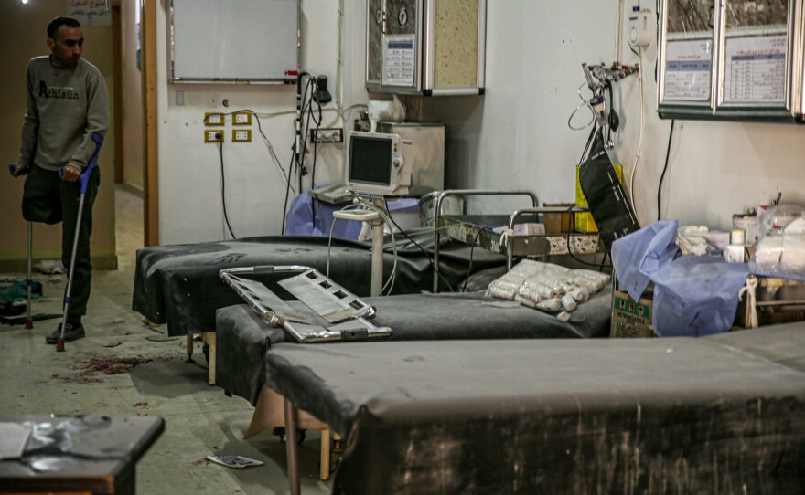A man walks with crutch in a hospital in western Aleppo, Syria, damaged by attacks by the Bashar al-Assad regime during the country's ongoing civil war.