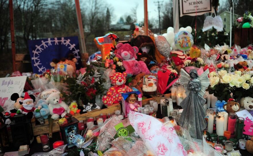 A makeshift shrine to the victims of the Sandy Hook Elementary school shooting is set up shortly after the massacre in December 2012 in Newtown, Conn.