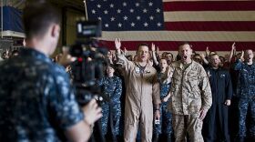 Sailors make a video aboard the USS Makin Island