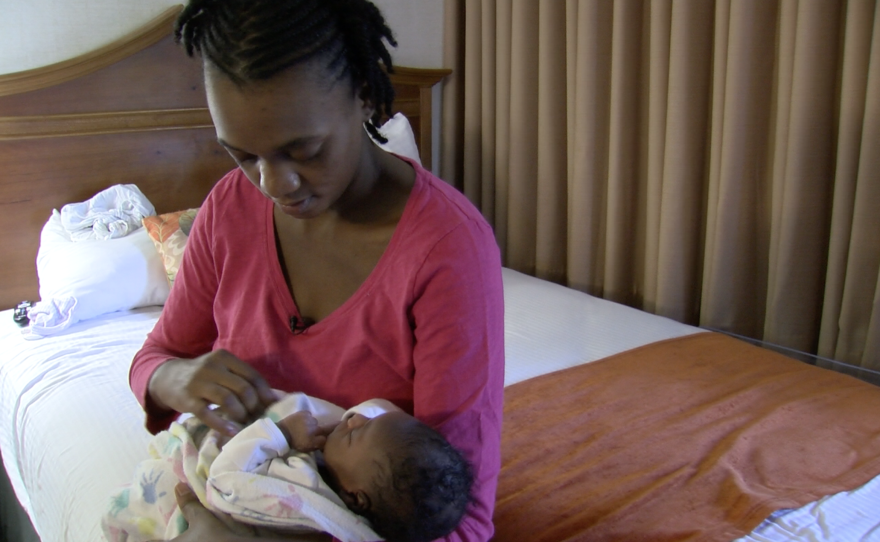 Sandra Alexandre, a 24-year-old Haitian woman, embraces her U.S.-born daughter, Sept. 30, 2016.