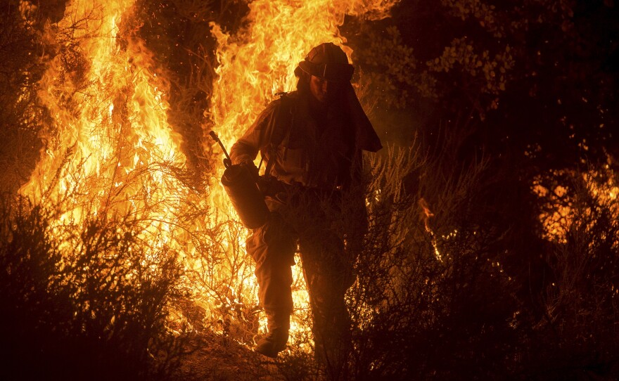 A firefighter lights a backfire while battling the Butte fire near San Andreas, Calif., on Saturday. The Butte fire has destroyed 86 homes and 51 outbuildings in rural Amador and Calaveras counties, where it covers an estimated 65,000 acres.