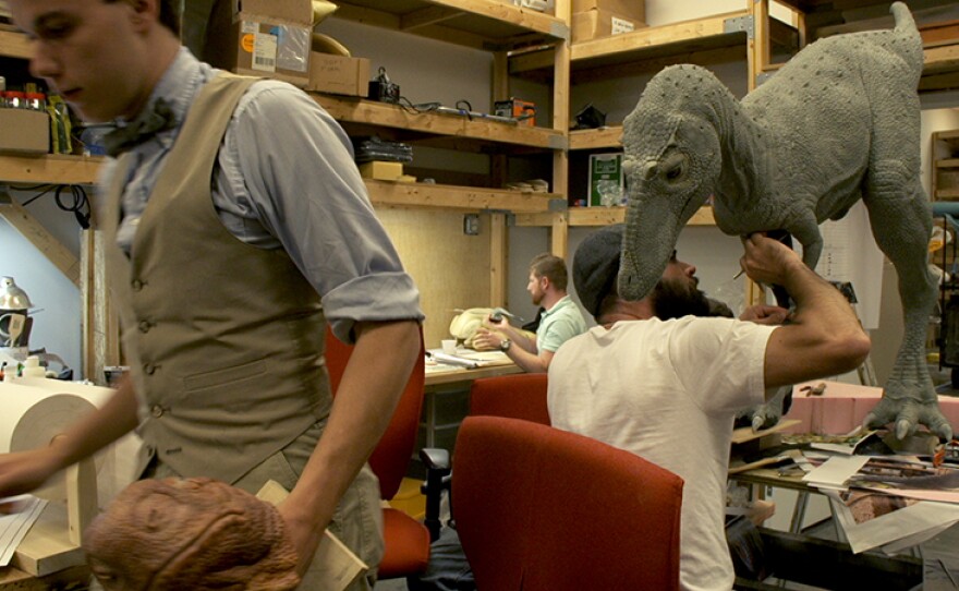 Jessie Pie sculpts a juvenile T-Rex for the Ark Encounter.