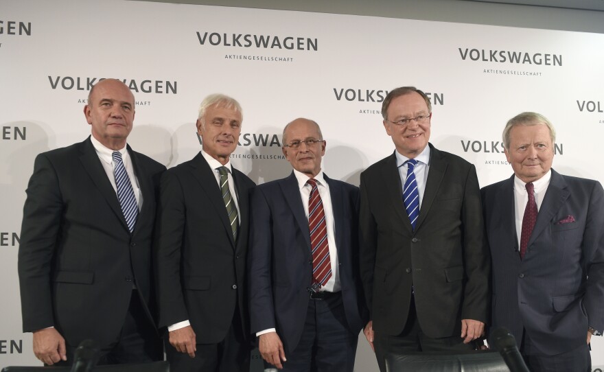 New Volkswagen CEO Matthias Mueller poses with Berthold Huber (third from right) acting head of the Supervisory board of Volkswagen, Stephan Weil (second from right) Prime Minister of Lower Saxony and member of the Supervisory board, Wolfgang Porsche (right) member of Supervisory board and Bernd Osterloh (left) head of Volkwagen's works council, at VW's headquarters in Germany on Friday.